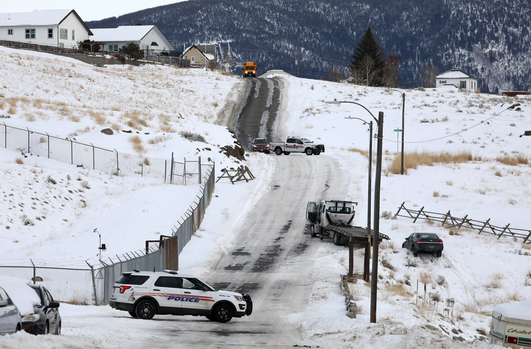 Car slips off icy street in Butte